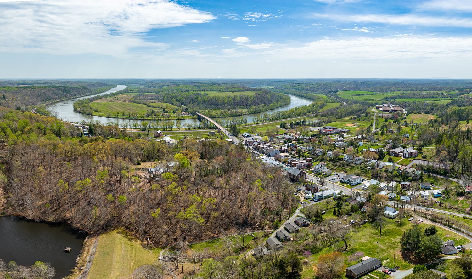 aerial image of a small town with a river in the background