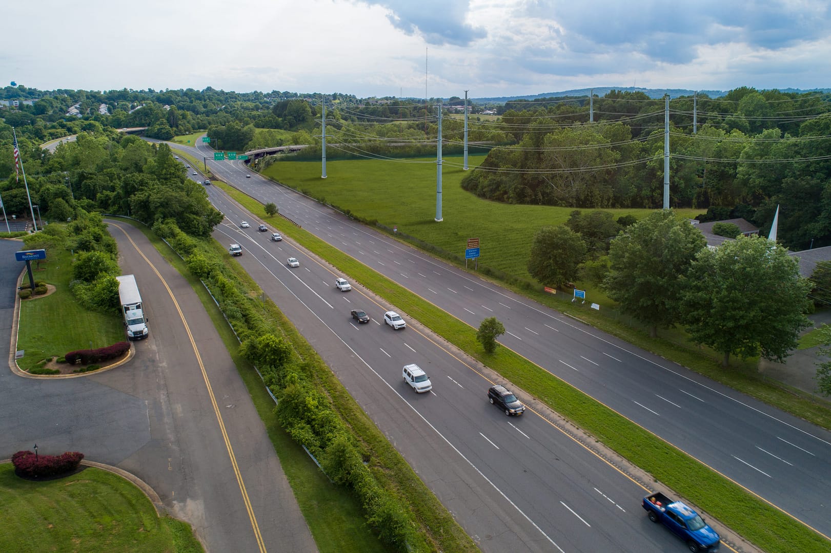 aerial image of a highway with power line towers running alongside