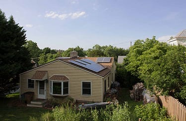 A suburban house with solar panels.