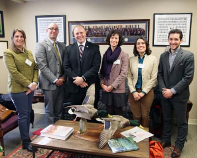 A group stands in an office.