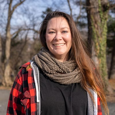 tiffany parker headshot with trees in the background